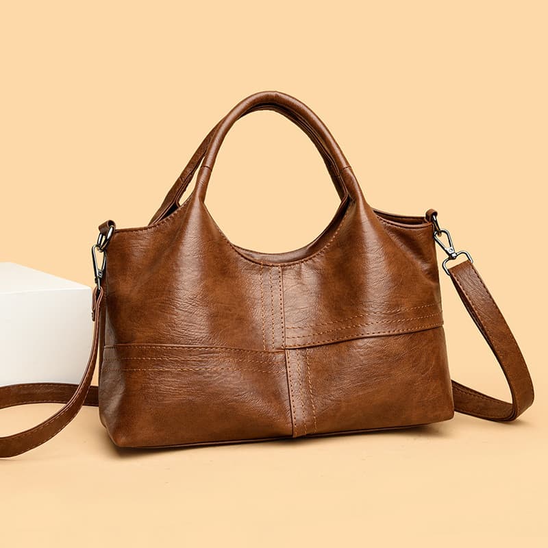Bolsa transversal feminina versátil, casual, de grande capacidade, texturizada, para uso diário.