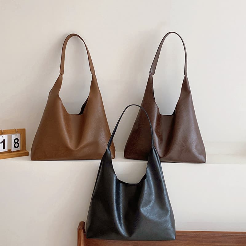 Bolsa de grande capacidade feminina 2025 outono inverno novo estilo simples couro macio de um ombro axilas saco Retro Co
