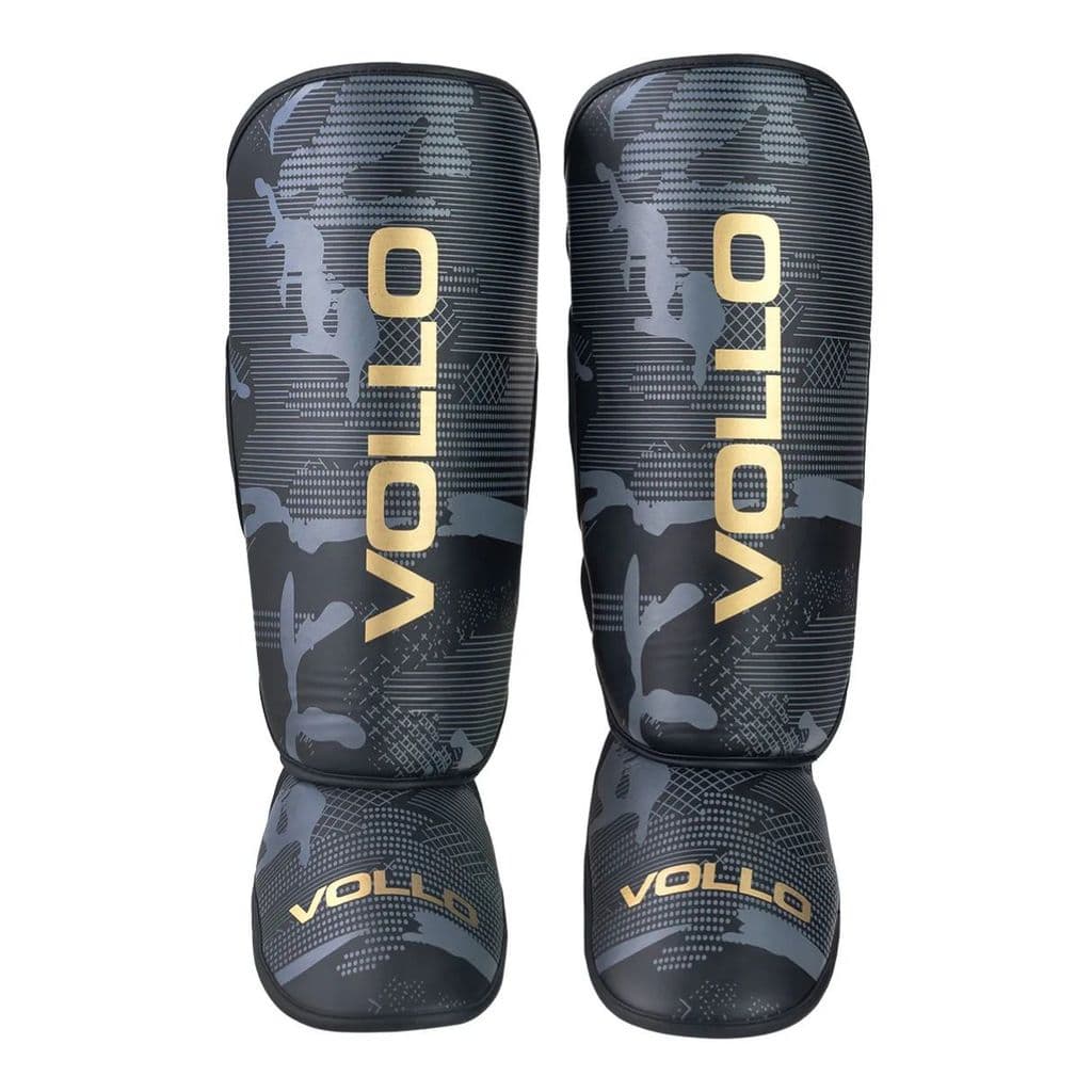 Caneleira Muay Thai MMA Injetada VOLLO Preta / DOURADA