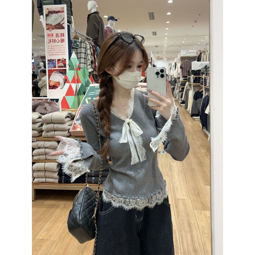Temperamento francês Bowknot com decote em V camisola feminina outono inverno Design redução de idade renda costura inte