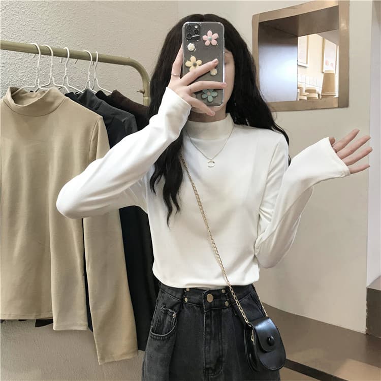 Meia gola alta de manga comprida camiseta feminina roupa interior outono inverno 2026 novo estilo camisa de fundo branca