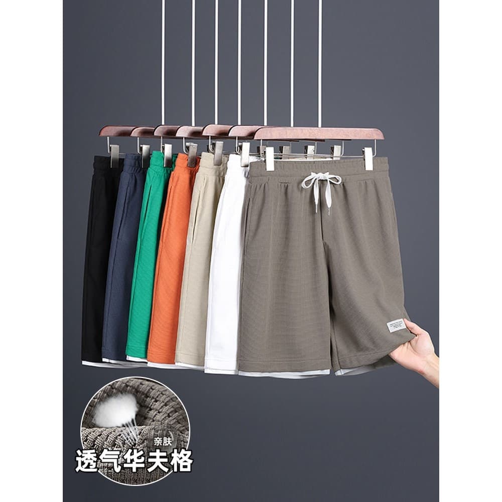 Shorts curtos masculinos verão novo estilo moda tendência High-End respirável cintura elástica calças de cinco pontos es