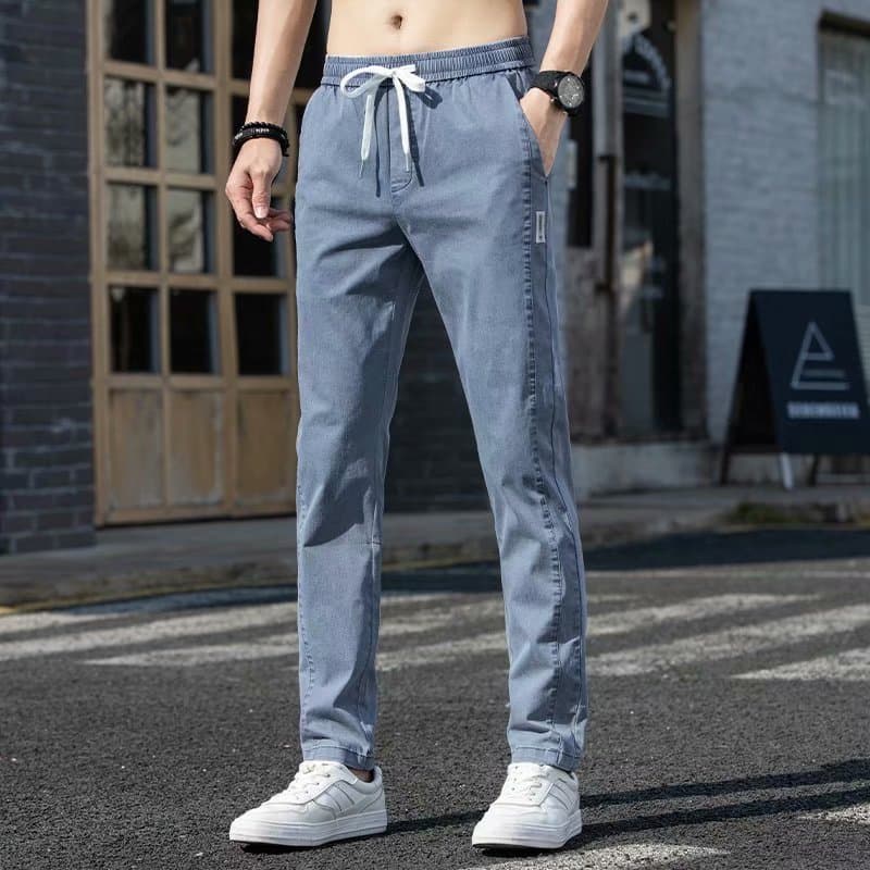 Outono Jeans masculino estiramento solto versão coreana moda rua Wear masculino fino-ajuste em linha reta puro algodão C