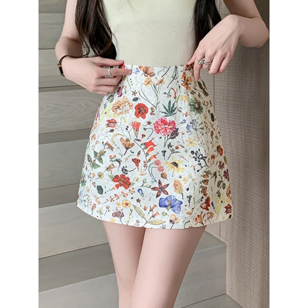 Saia Floral francesa feminina verão 2026 novo estilo pequeno cintura alta mais magro olhar Anti-reflexo a linha saia qua