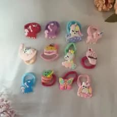 elástico de cabelo com aplique