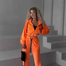 Novo conjunto casual feminino com blocos de cor, bolsos listrados, casaco cardigã de manga comprida e calças compridas.