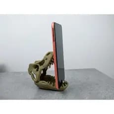 Excelente suporte para telefone ou tablet no estilo crânio de T-Rex.