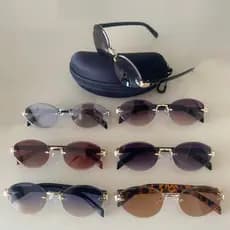 Óculos de Sol Feminino Oval Sem Aro Retrô Metal UV400 Leve Elegante + Estojo