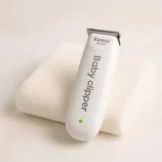 Máquina de Cortar Cabelo Infantil KM-1319 Baby Clipper Silenciosa e Segura para Bebe Pelos