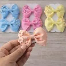 12 laços infantis/laços com apliques /laços meninas /laços com flores