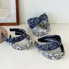 Nova faixa de cabelo feminina elegante com bolinhas, padrão de caju, design de nó alto cruzado e parte superior em tecid