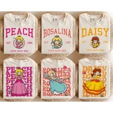 Camiseta Estilo College 100% Algodão Feminino Adulto e Infantil Princesas Jogo Super Mario Bros