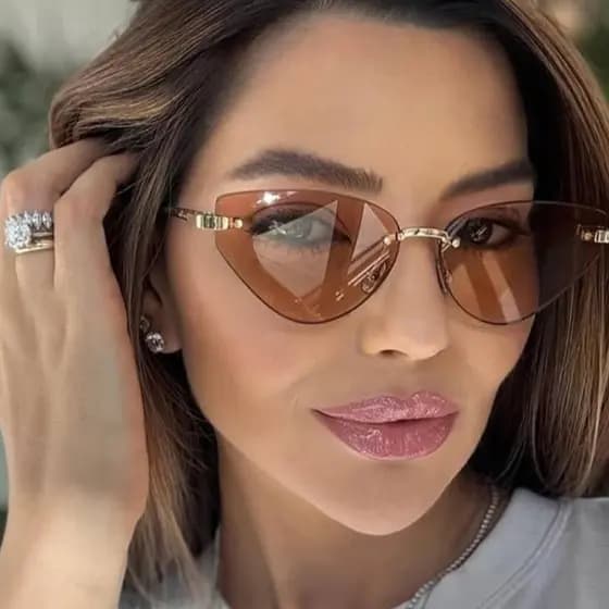 Novo estilo de Metal sem moldura olho de gato High-End rua tiro senhoras óculos de sol moda férias condução na moda ócul