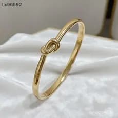 Pulseira simples e fina de aço inoxidável com nó, unissex, cor dourada, à prova d'água.