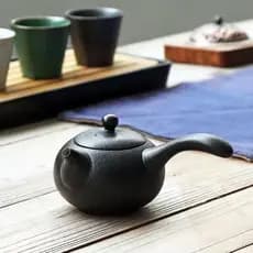 Bule de cerâmica preta único pote doméstico moderno simples alça lateral de cerâmica areia roxa conjunto de chá Kung Fu