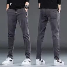 Guangzhou Shintang Jeans masculino versão coreana na moda magro ajuste em linha reta calças casuais tamanho grande macac