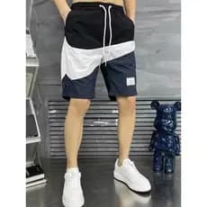 Shorts curtos masculinos verão novo estilo costura contraste cor reta calças de perna média calças de praia Street Wear