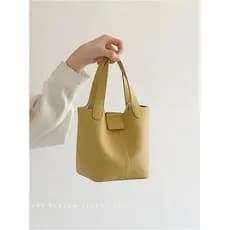 Bolsa feminina de couro macio portátil pequeno saco 2026 verão novo estilo na moda ins Casual balde saco All-Match ombro