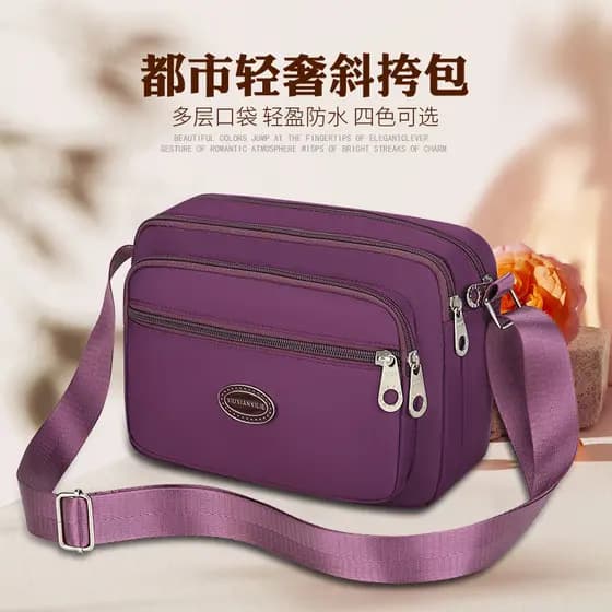 Bolsa de lona 2024 novo estilo feminino saco do mensageiro feminino Oxford pano mãe de meia-idade pequena mochila náilon