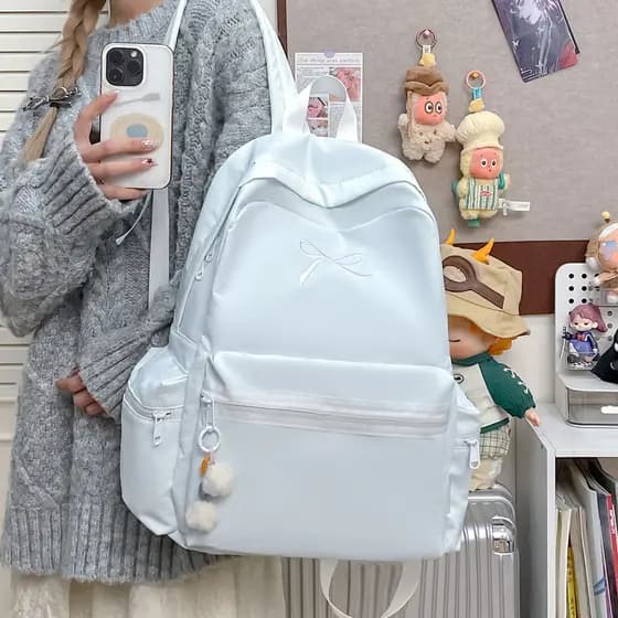 Clássico simples bordado arco júnior estudantes do ensino médio Campus mochila nicho japonês cor sólida mochila de compu