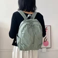 2026 novo estilo leve mochila repelente de água de alto valor dopamina mochila de viagem viagem diária estudante pequeno