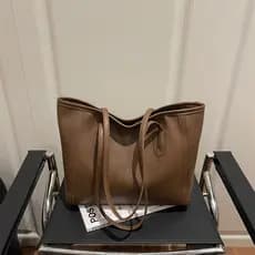 Simples moda grande capacidade cor sólida 2026 primavera novo estilo na moda Retro Casual bolsa de um ombro bolsa femini