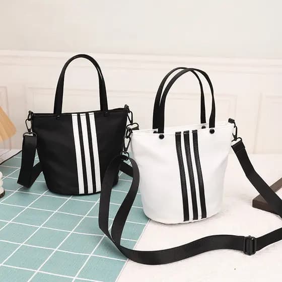Mão transportar contraste cor listrado balde saco feminino 2024 novo estilo versão coreana nicho na moda Casual bolsa de