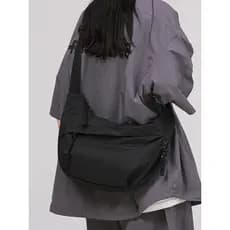 Moda grande capacidade bolsa de ombro feminina 2026 novo estilo Casual mochila masculina saco do mensageiro estilo Commu