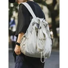Mochila feminina 2026 novo estilo cordão bolso leve viagem pequena mochila Design nicho masculino estudante mochila