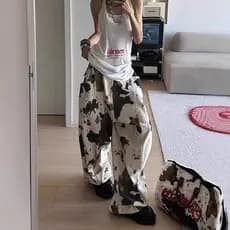 Calças femininas com estampa de couro estilo retrô americano, tendência 2026, novas calças jeans largas e soltas com cor