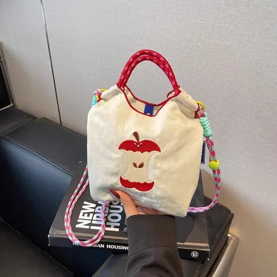 Bolsa feminina estilo 2026 novo estilo bonito Apple Crossbody saco do telefone móvel bordado lona balde portátil verão c