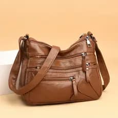 Bolsas femininas idosas de meia-idade 2026 Novo estilo Mochila feminina de couro macio Bolsa mensageiro de um ombro de g