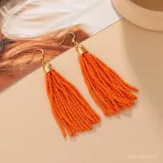 Brincos artesanais de estilo étnico vintage europeu e americano para mulheres, versáteis e elegantes, com borlas colorid