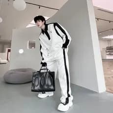 Outono nicho High-End preto branco contraste cor terno esportivo masculino solto Casual rufião bonito calças Design tern