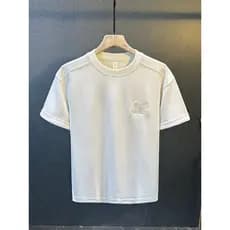 Moda meia manga verão novo estilo 2026 masculino cor sólida bordado topo de manga curta pesado luz luxo moda High-End se