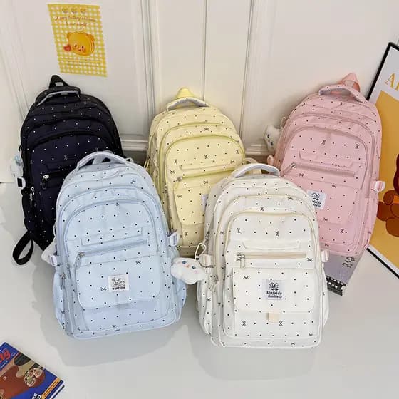 Mochila escolar para meninas do ensino fundamental, com um estilo jovial, design de laço com bolinhas, alto apelo estéti