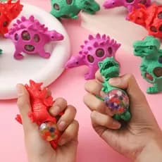 1Pc Dos Desenhos Animados Mão Dinossauro Espremer Uva Grânulo Bola Romance Brinquedo Música Descompressão