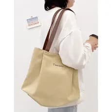 Bolsa de lona feminina de grande capacidade 2025 novo estilo bolsa de ombro passagem de trabalho bolsa de pano de mão es