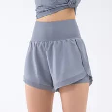 Cintura alta abdômen Slinking secagem rápida Anti-exposição Shorts esportivos feminino respirável solto correndo Fitness