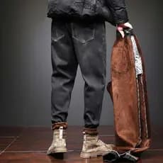 Outono inverno forro de lã engrossado Jeans masculino solto estiramento mais gordura plus Size Harem calças inverno mais