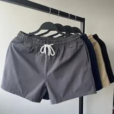 Homens cor sólida estiramento calças de três pontos de secagem rápida Shorts esportivos Fitness natação férias lazer cal