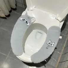 Bonito dos desenhos animados guaxinim almofada de toalete quatro estações Universal adesivo toalete almofada do toalete