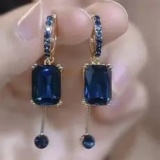 Brincos leves de luxo, cristal de diamante embutido e pedras preciosas azuis, com borlas longas.