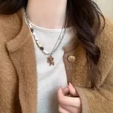 Cerâmica frisada urso costura colar feminino único moda nicho All-Match camisola corrente 2025 venda quente