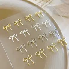 10 Pçs Arco Deco Encantos Da Arte Do Prego 3D Prata/Ouro Bowknot Fita DIY Decoração Peças Acessórios Manicure Luxo NJHN