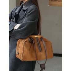 2026 saco de boliche de couro fosco 2025 novo estilo luz luxo couro genuíno axilas Baguette saco Commuter All-Match bols