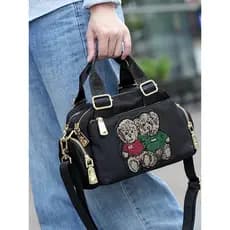 Bolsa mensageiro portátil Popular deste ano 2026 novo estilo Casual urso Boston travesseiro bolsa de ombro pequena à pro