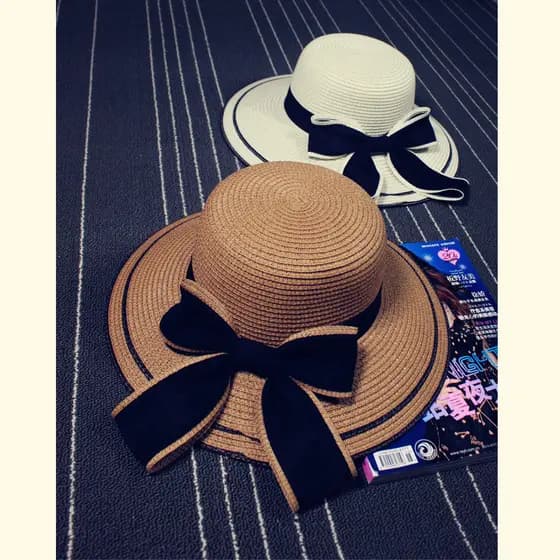 Primavera verão novo produto Xiaoxiangfeng praia protetor solar chapéu de palha feminino elegante grande arco pote chapé