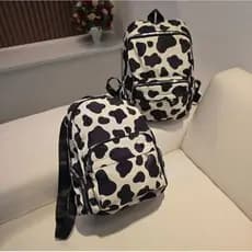 Mochila Vaca Vaquinha Malhada Fofa Criança Faculdade Feminina Linda Casual Preta e Branca