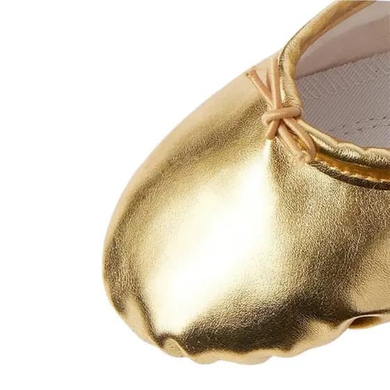 Sapatilha de ballet dourada em korino